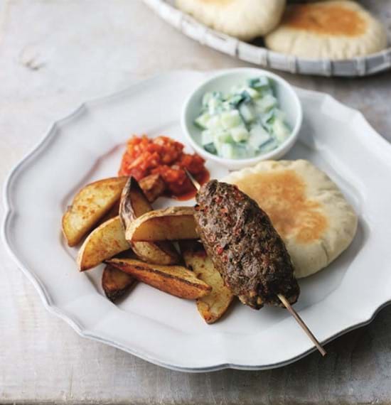 Kofta Kebabs served with Pitta Discs,Paprika Chips,Raita and Spicy Tomato Chutney Kofta Kebabs served with Pitta Discs,Paprika Chips,Raita and Spicy Tomato Chutney